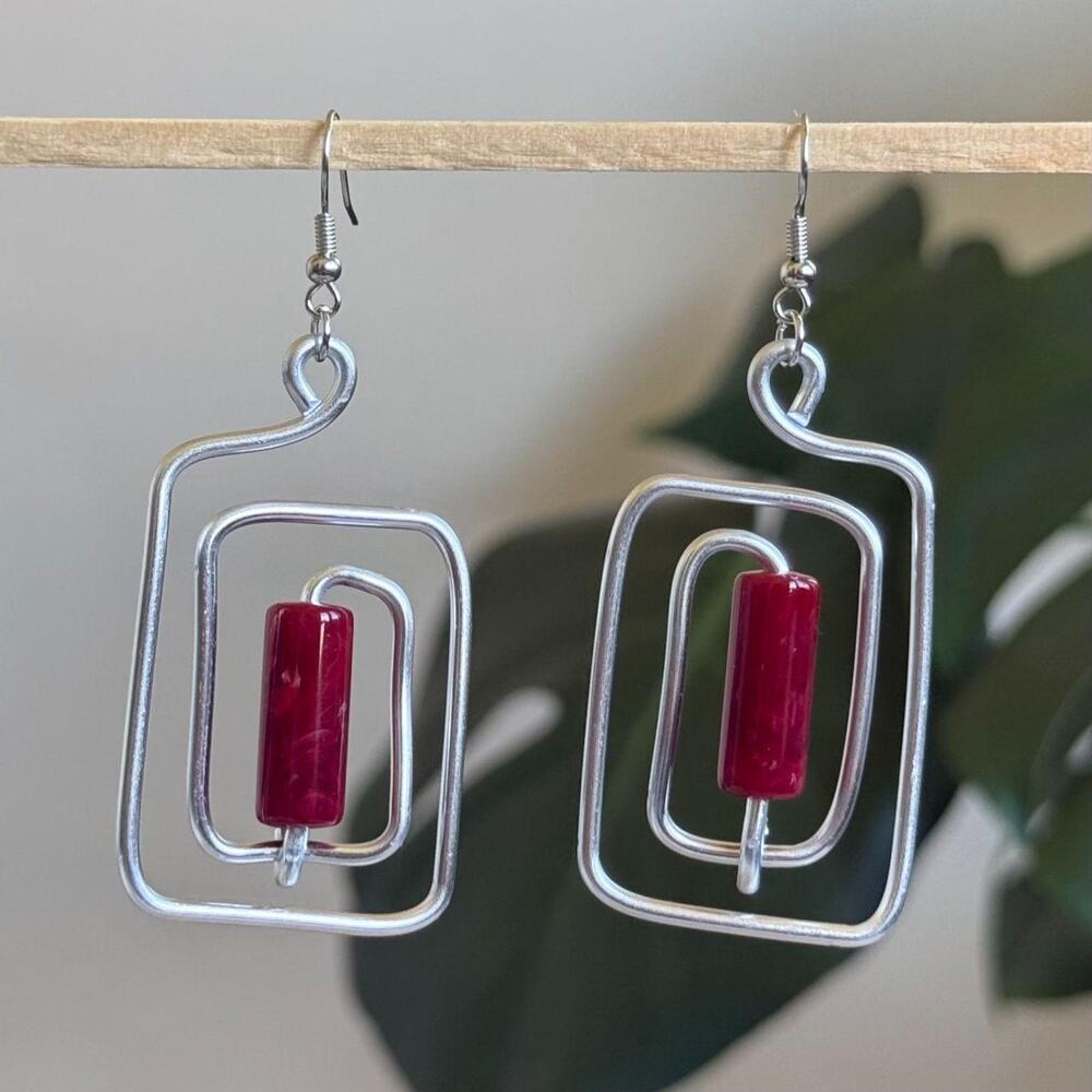 handmade silver wire spiral earrings with crimson red colored tube beads